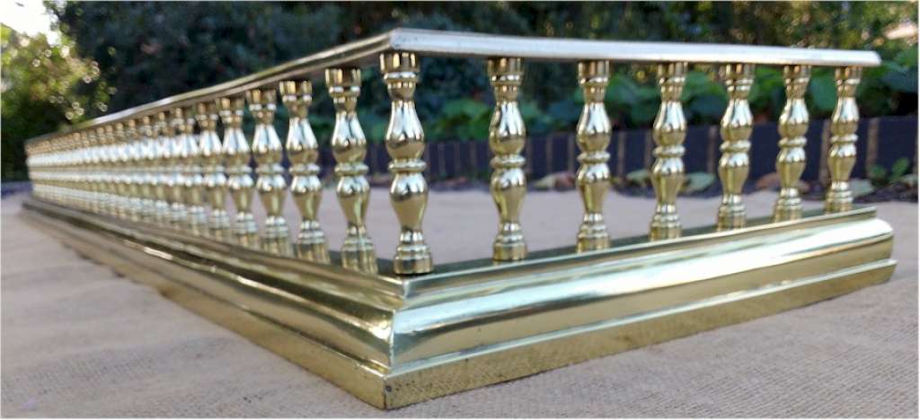 Fireside fender in polished brass