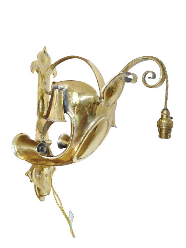 Spectacular arts and crafts wall light in hammered brass