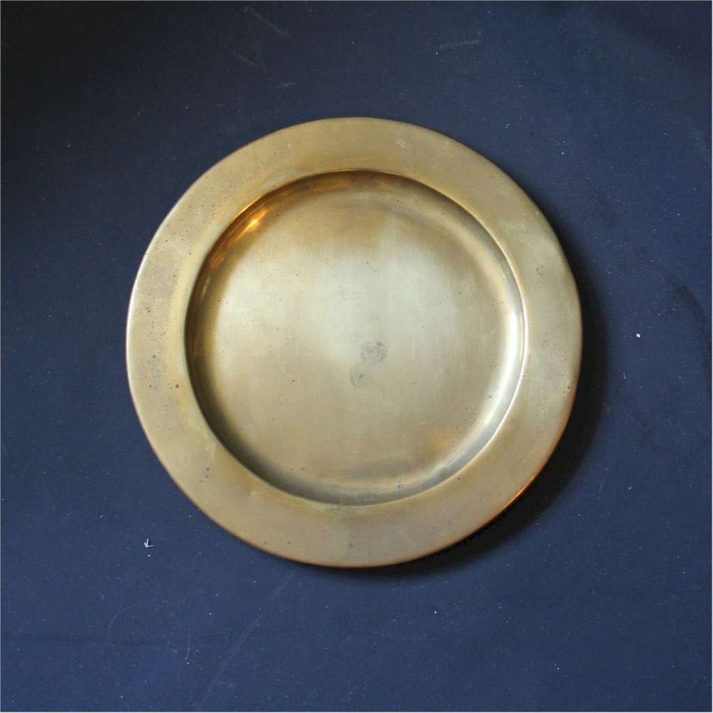 Plain brass dish made by the Keswick School of Industrial Art