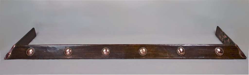 Arts and crafts fire fender in copper , hammered decoration
