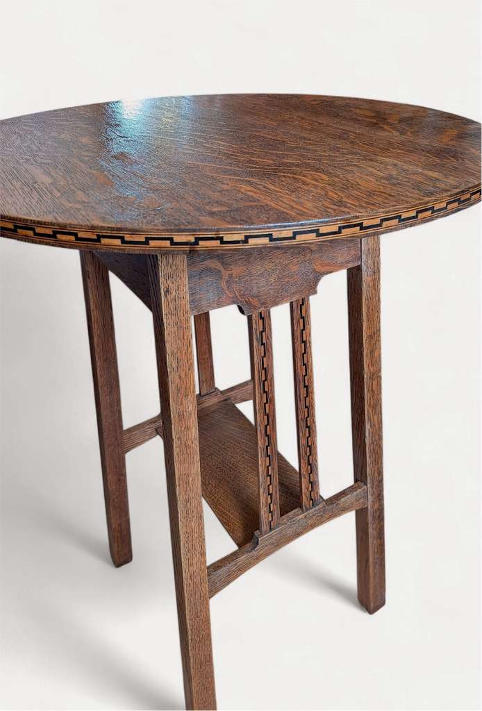 Arts and crafts inlaid circular side table in oak