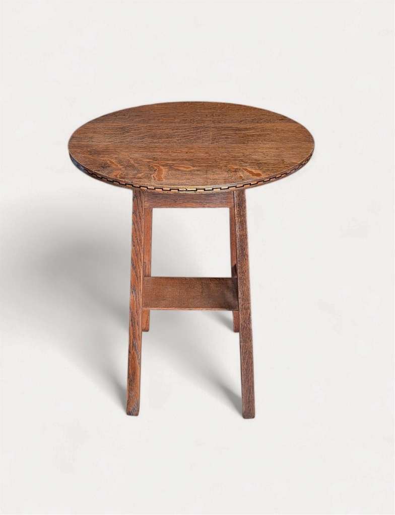 Arts and crafts inlaid circular side table in oak