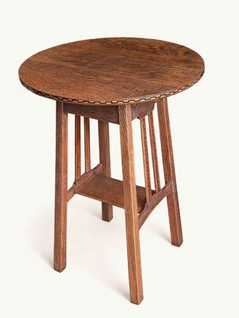 Arts and crafts inlaid circular side table in oak