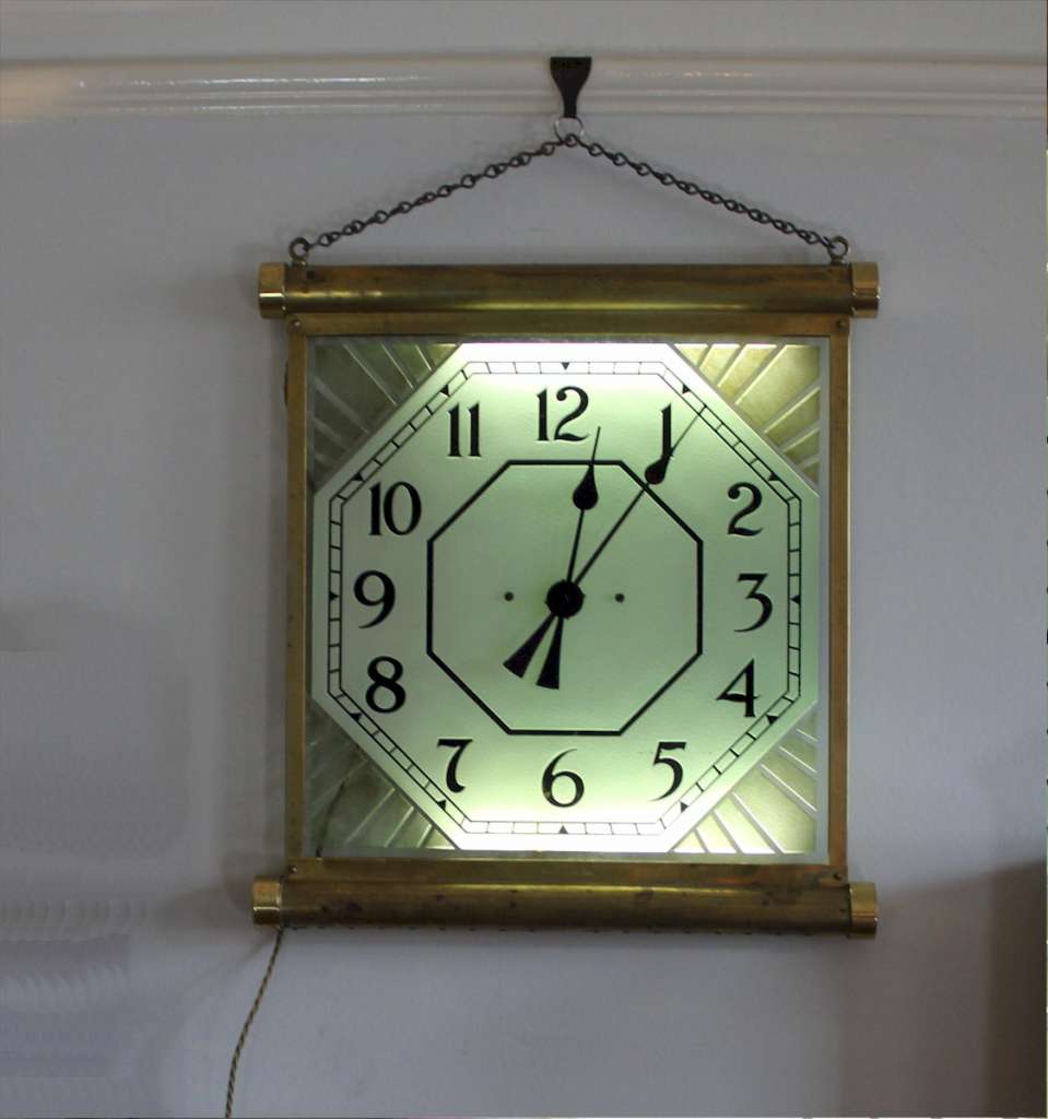 1930's brass illuminated Cinema clock. Made in England by 