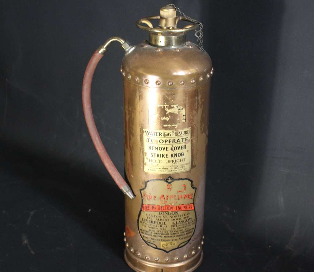 Vintage British copper fire extinguisher.