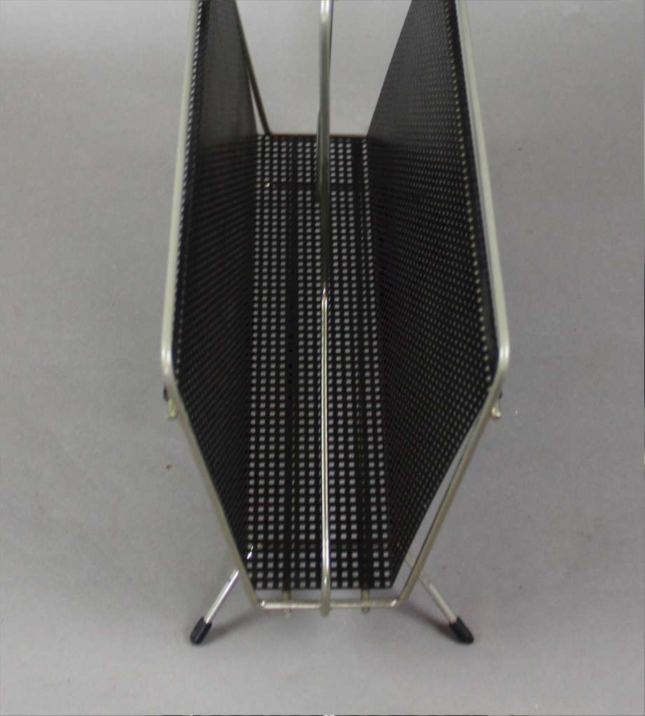 Perforated magazine rack from the 1950's