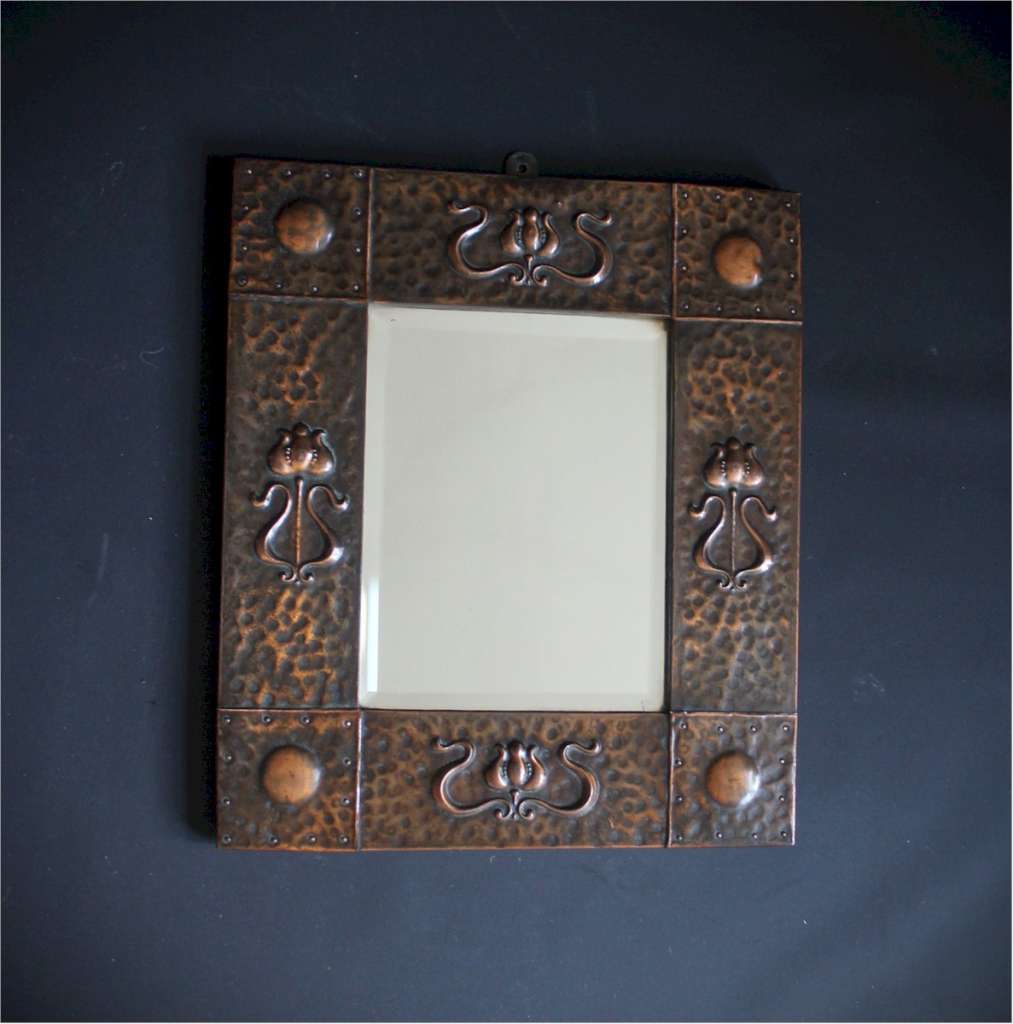 Small arts and crafts wall mirror in copper