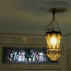 Copper lantern with clear blown glass