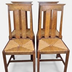Arts and crafts oak dining chairs by Liberty