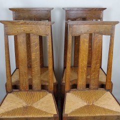 Arts and crafts oak dining chairs by Liberty