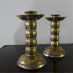 Pair of brass arts and crafts candlesticks