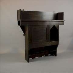 Arts and Crafts wall cabinet in oak by Liberty & Co