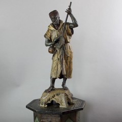 Large spelter figure of an Arab Bedouin playing the mandolin